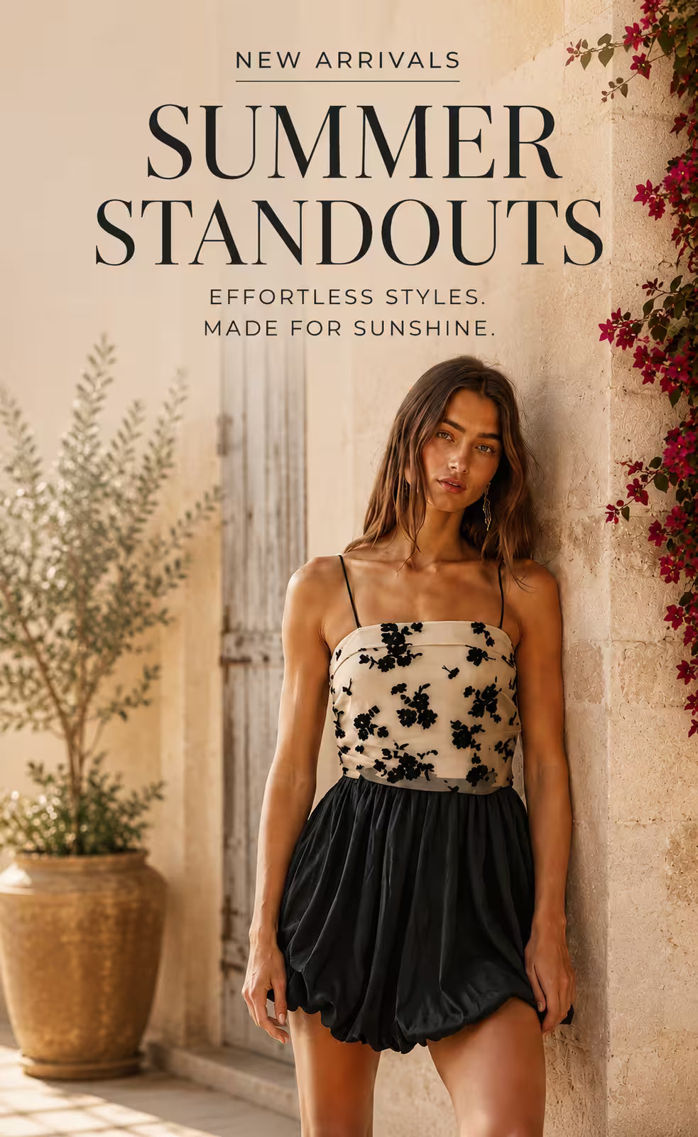 Shop Emma's of Emma' Boutique banner image for Mobile shows a model wearing a dress with a black bottom shirt, and flower pattern on top in white and black
